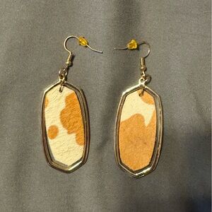 Women’s cowhide gold earrings. Never worn